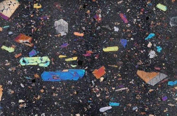 A rock thin section seen through a polarising microscope